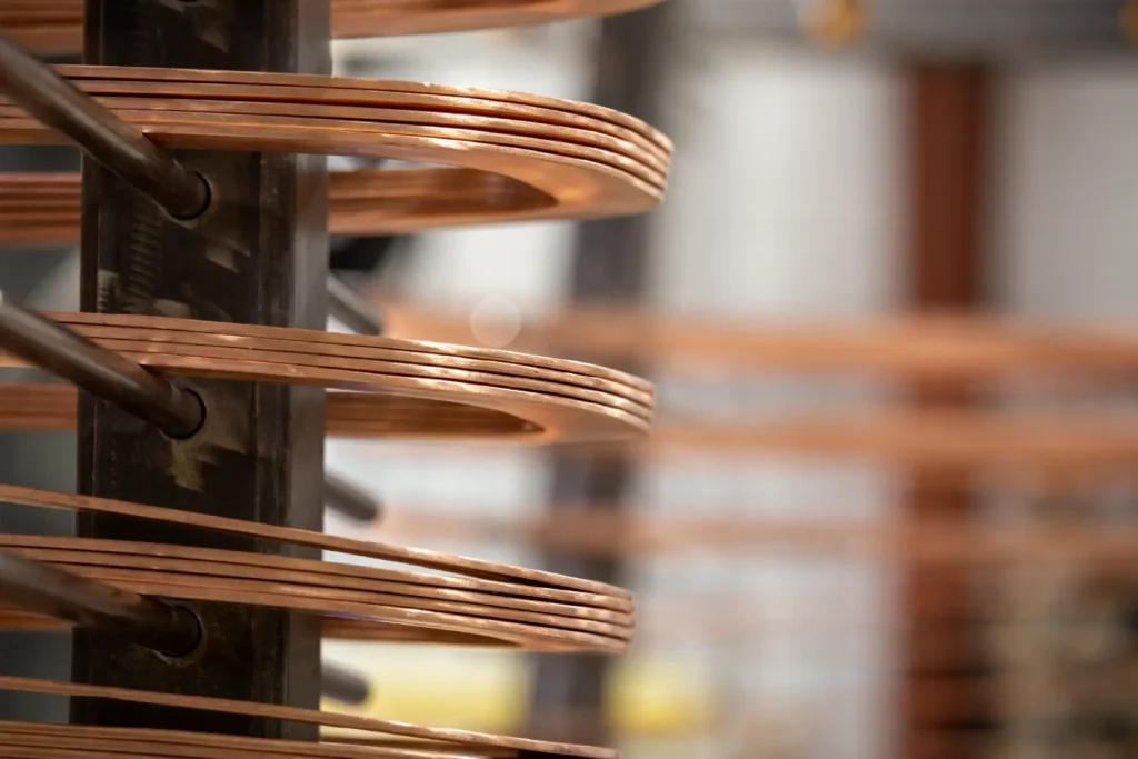 Sidewinders copper rotor coils on winding rack.